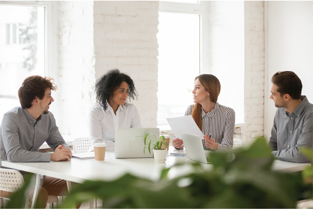 Multiracial male and female employees having discussion and team meeting | Botkeeper