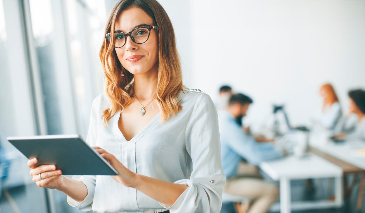 Elegant-businesswoman-standing-office-with-digital-tablet | Botkeeper