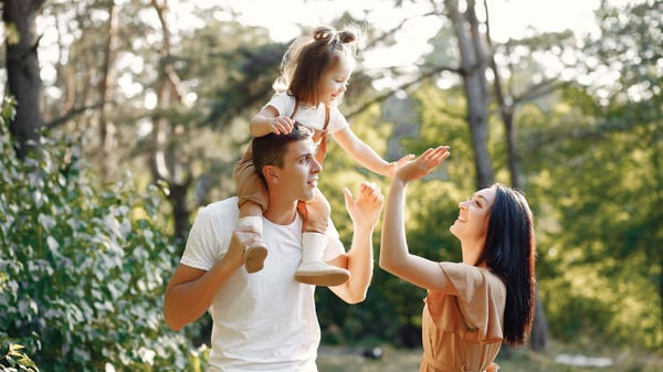 Husband & wife bonding with their child | Botkeeper