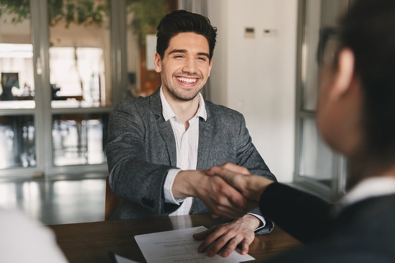 business-career-placement-concept-happy-caucasian-man-30s-rejoicing-shaking-hands-with-employee-when-was-recruited-during-interview-office