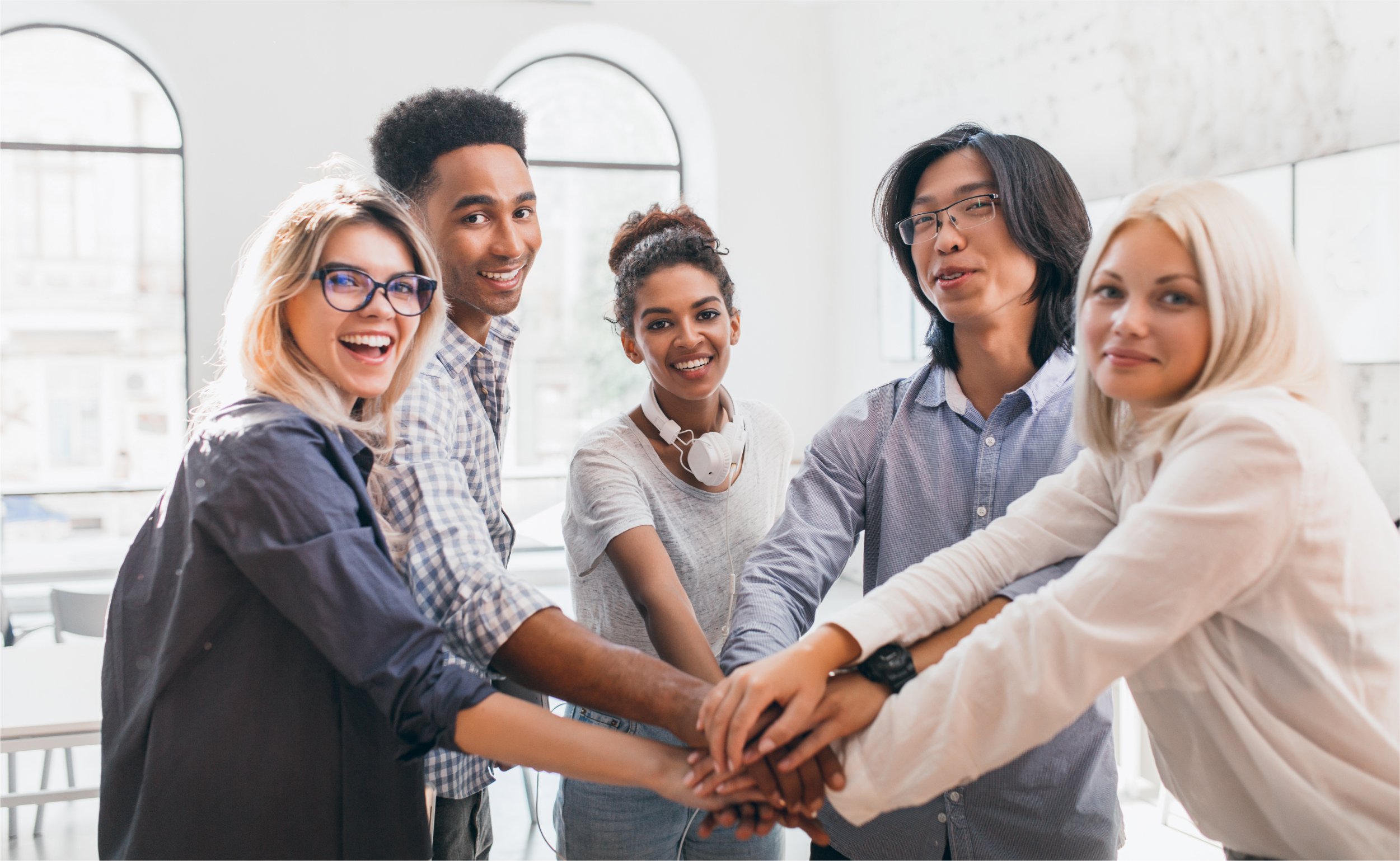 handsome-african-guy-with-happy-face-expression-supporting-his-friends-before-conference-indoor-portrait-work-team-young-international-specialists-preparing-meeting-with-chief | Botkeeper