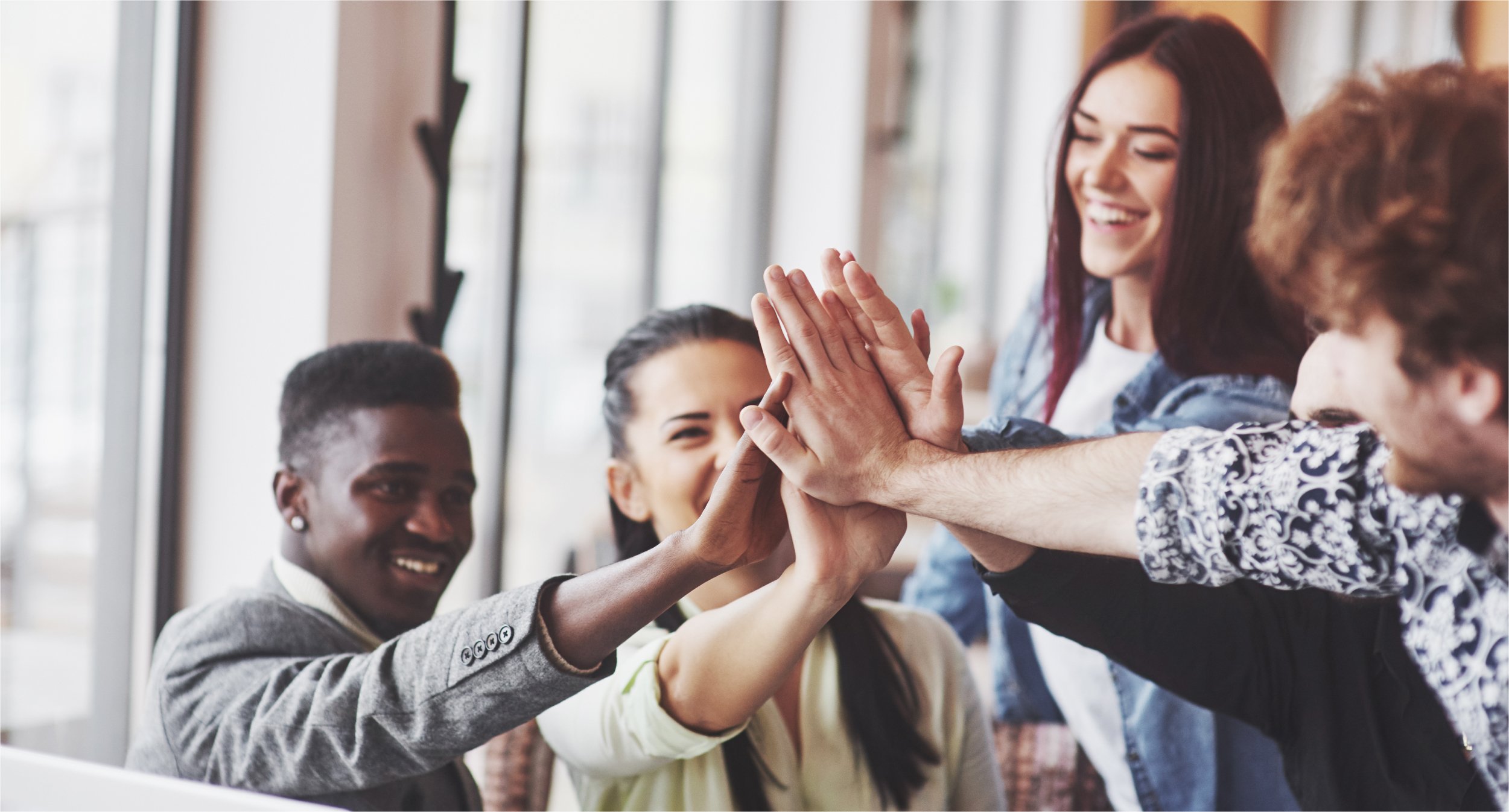 happy-young-entrepreneurs-casual-clothes-cafe-table-business-office-giving-high-fives-each-other-as-if-celebrating-success-starting-new-project_Botkeeper