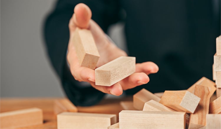 man-wooden-cubes-table-management-concept