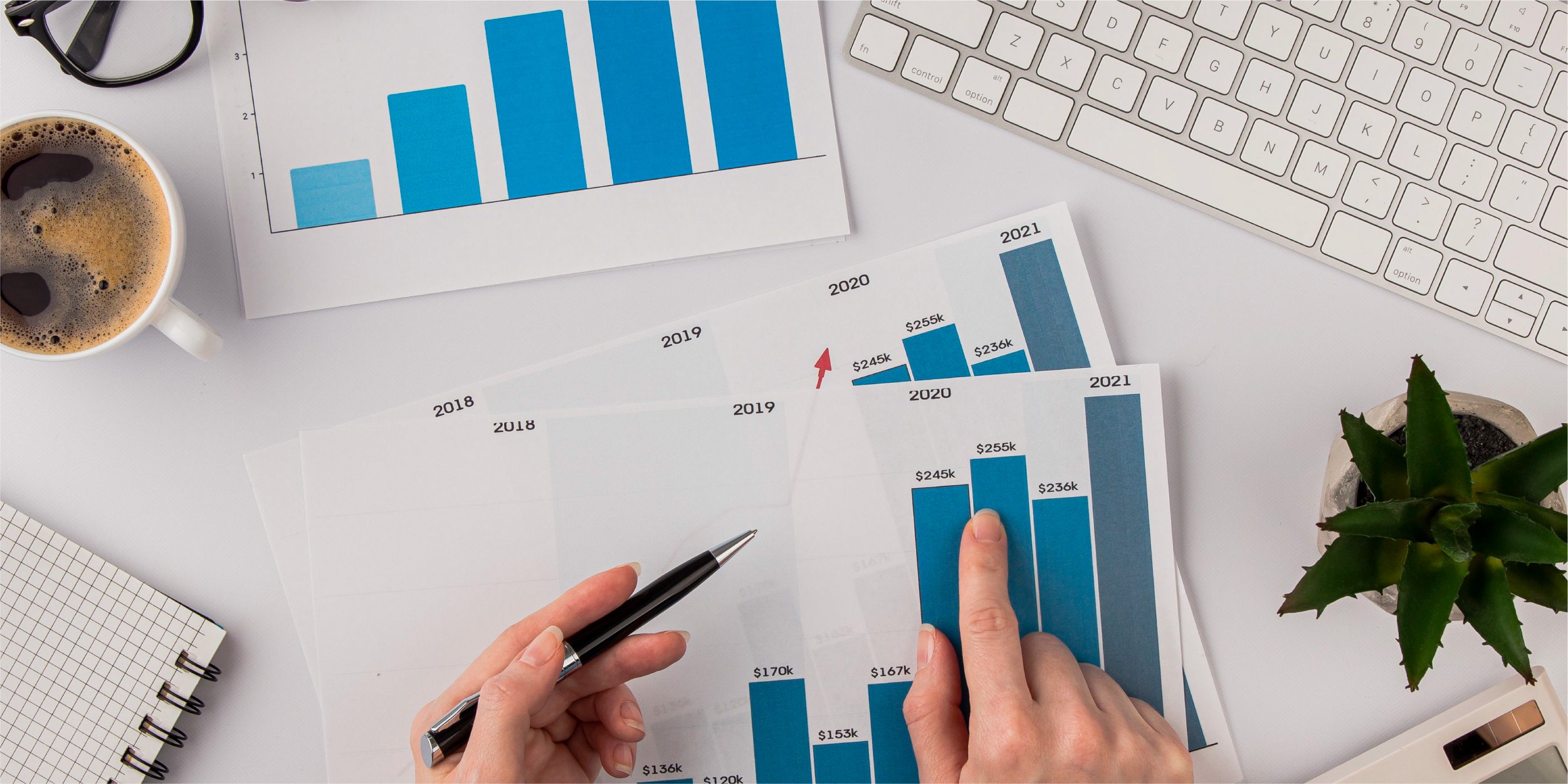 top-view-office-desk-with-growth-chart-hands_Blog