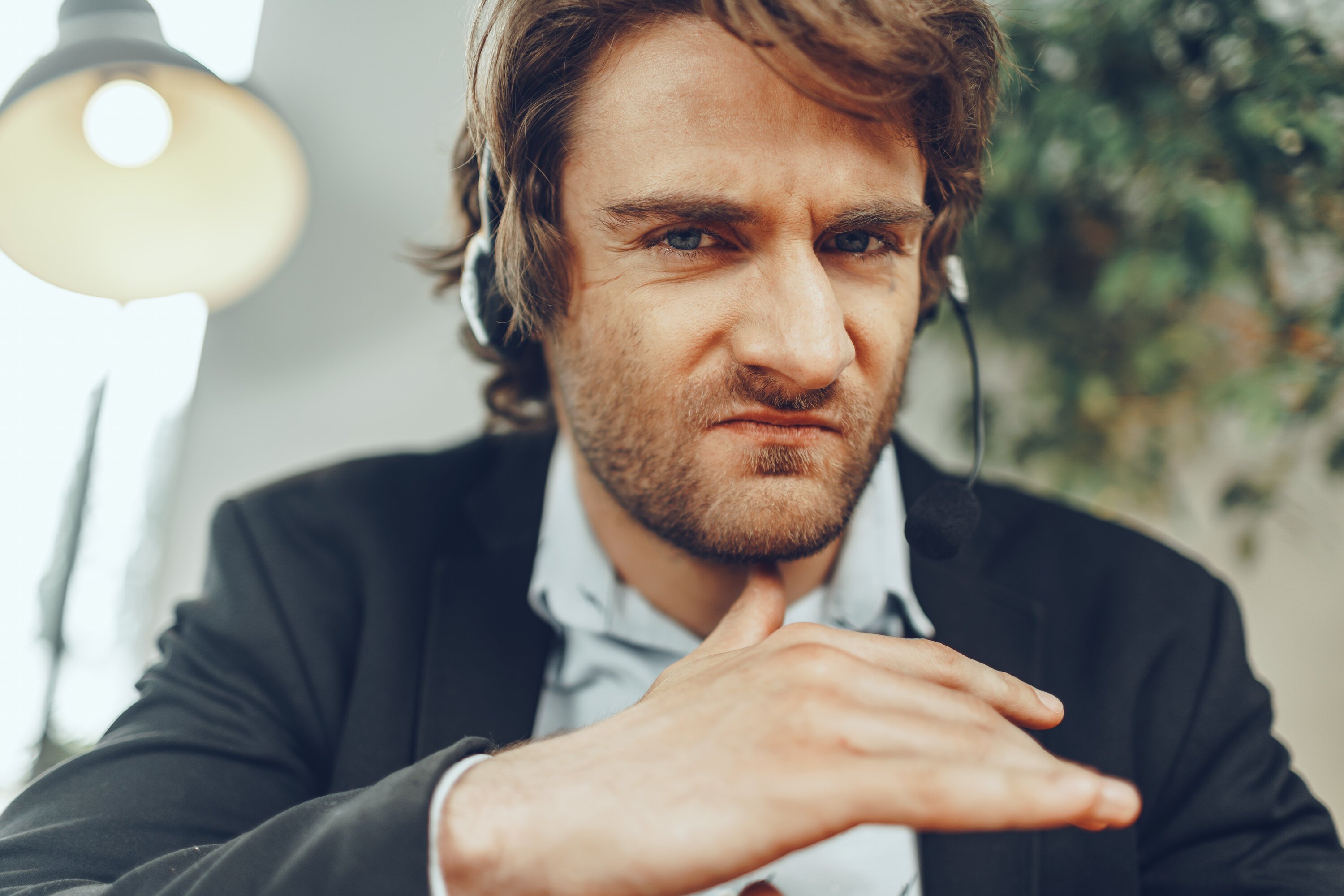rsz_close-up-portrait-angry-businessman-with-headset-having-stressful-online-conversation