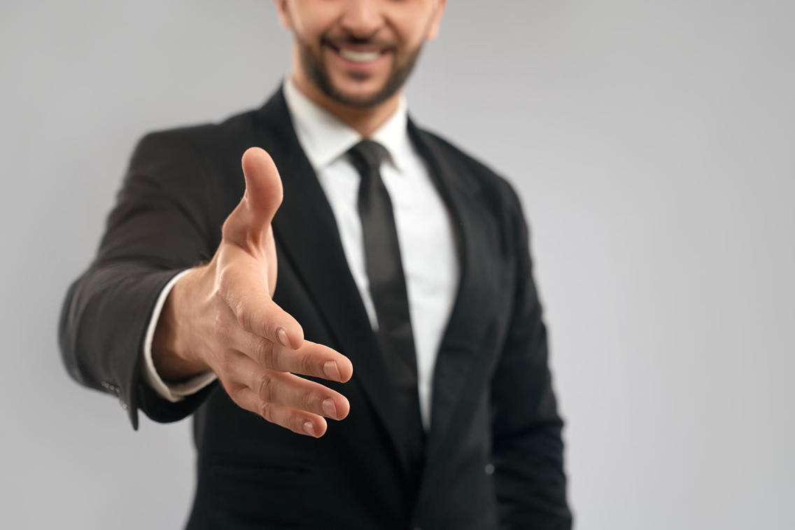 businessman-giving-hand-shake-botkeeper