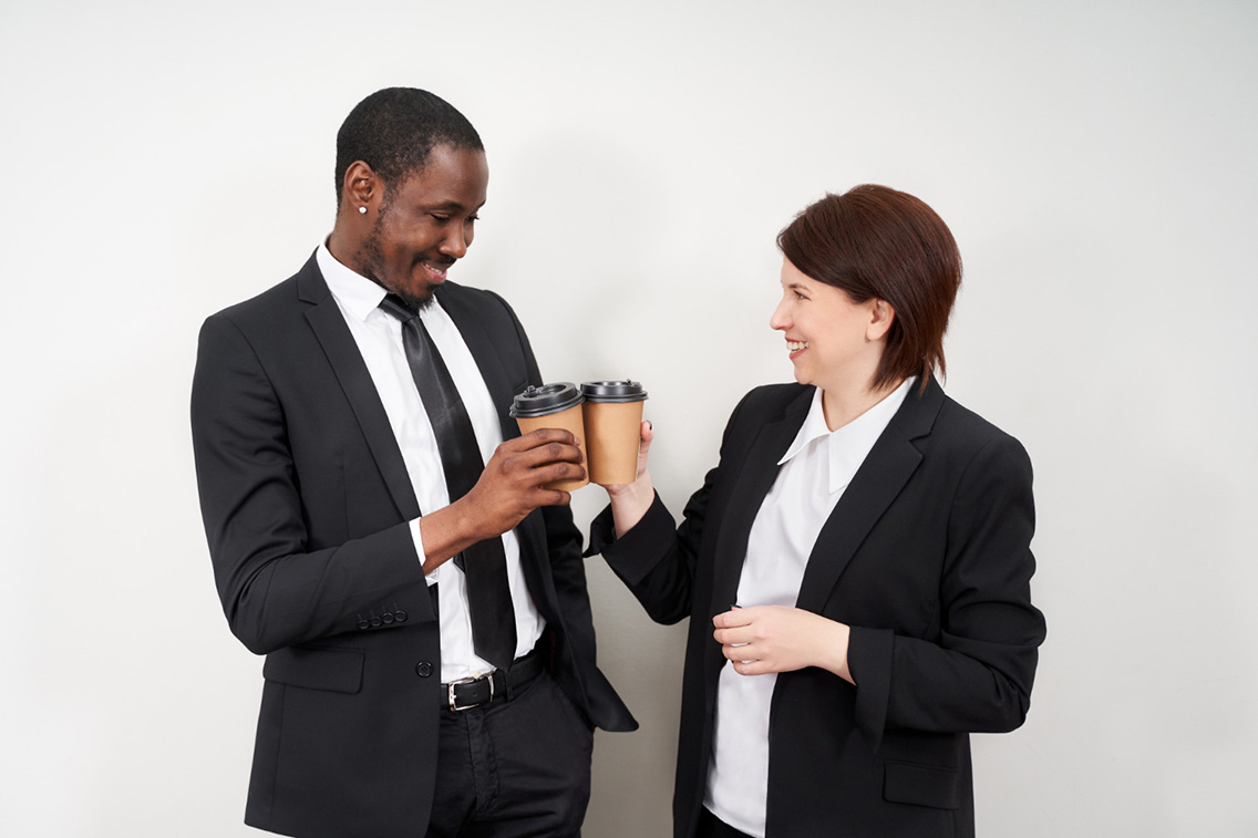 new-corporate-partners-toasting-coffee-after-finalizing-business-deal-caucasian-woman-african-man-botkeeper