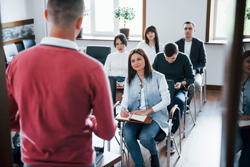 red-shirt-group-people-business-conference-modern-classroom-daytime-botkeeper
