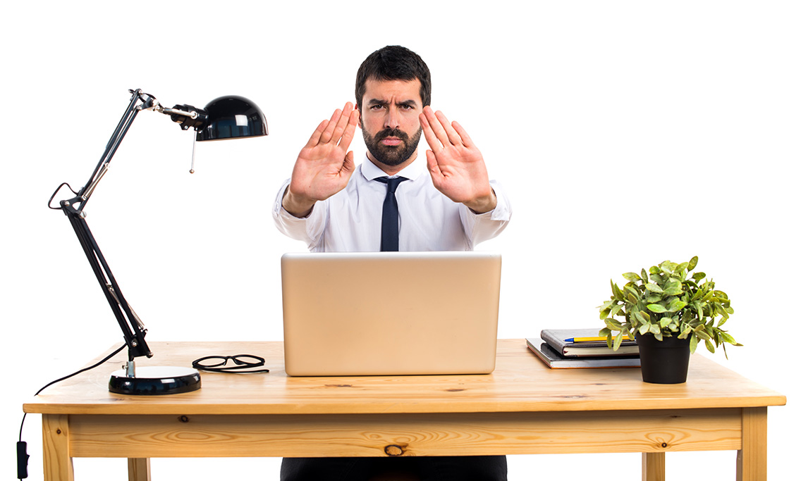 businessman-his-office-making-stop-sign-botkeeper