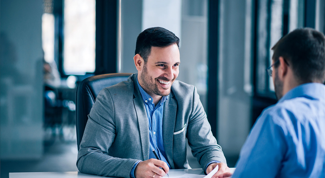 handsome-male-client-signing-document-meeting-with-real-estate-agent-32