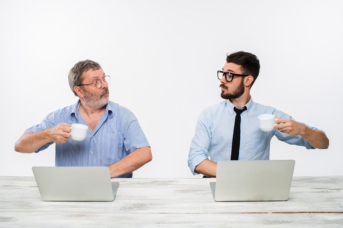 two-colleagues-working-together-office-white-botkeeper