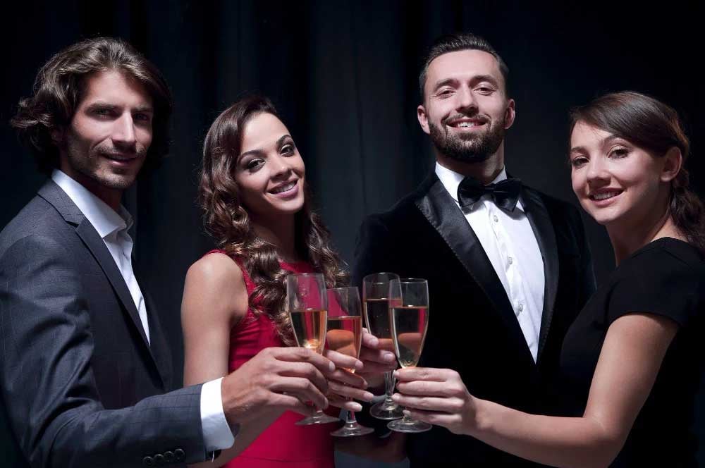 group happy business team toasting with champagne-black background ai unchained