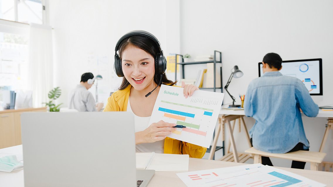 asia-businesswoman-social-distancing-new-normal-situation-virus-prevention-while-using-laptop-presentation-colleagues-about-plan-video-call-while-work-office-life-botkeeper