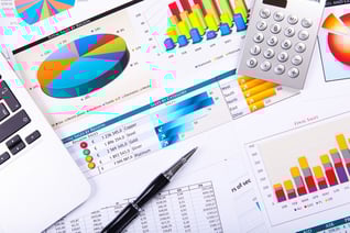Financial paper charts and graphs on the table