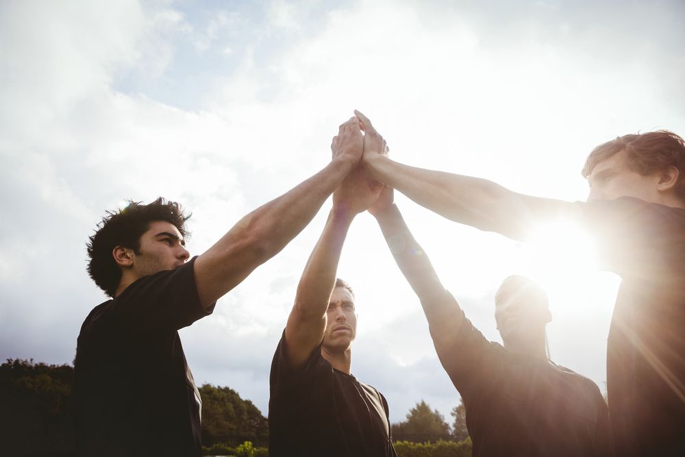 Rugby players standing together before match at the park  | Botkeeper