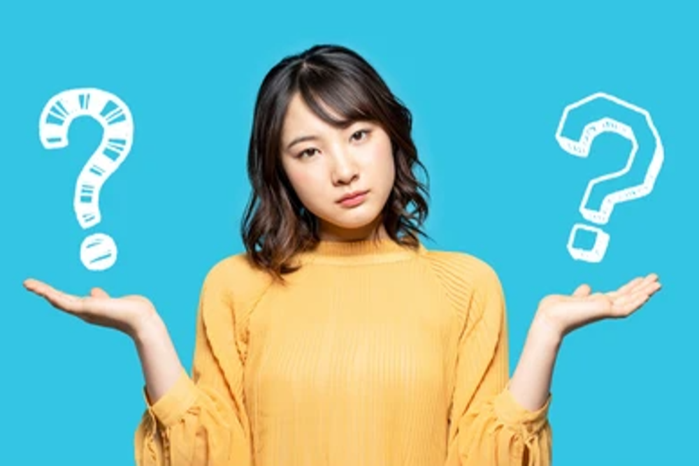 young-woman-comparing-two-things-260nw-1446984338-1-1