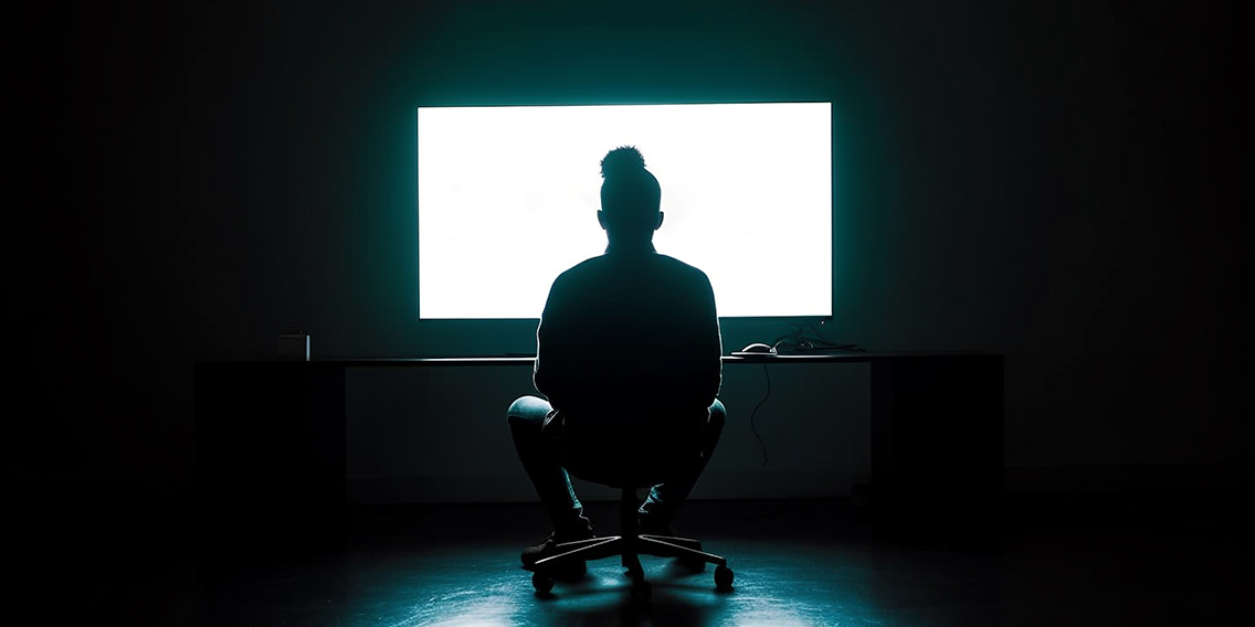 silhouette-businessman-working-computer