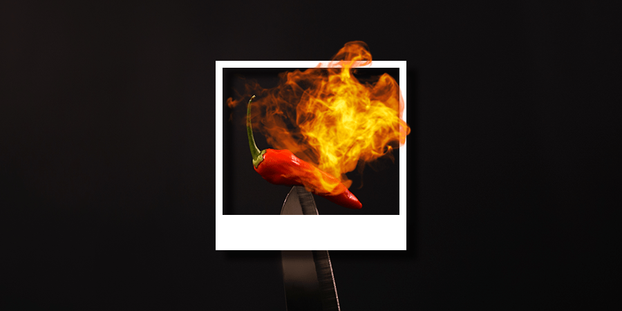 chili-bled-with-fire-on-black-background-