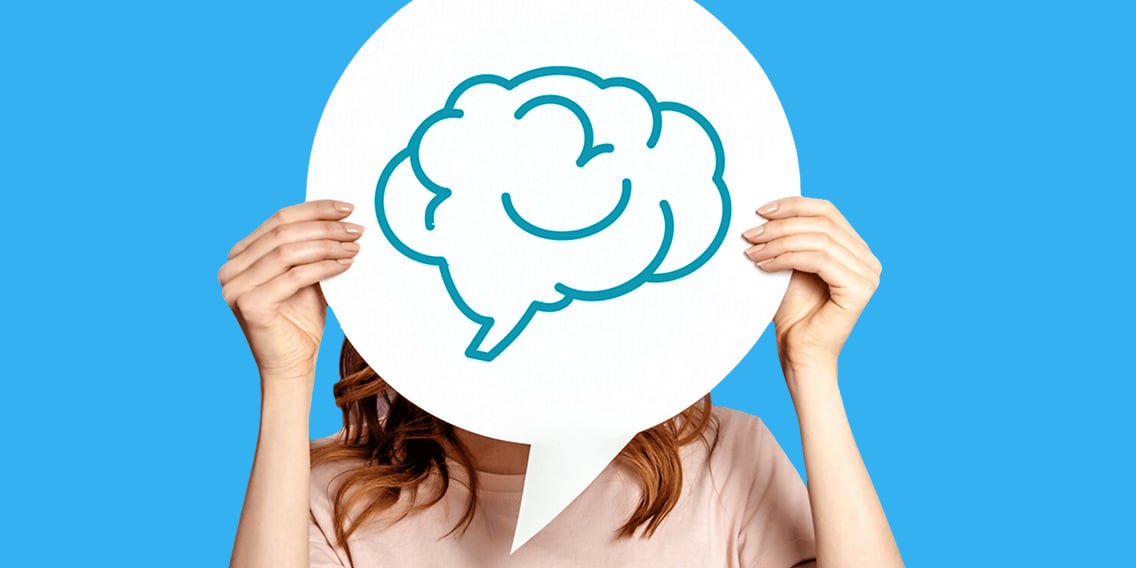 girl-holds-a-poster-with-the-image-of-the-human-brain